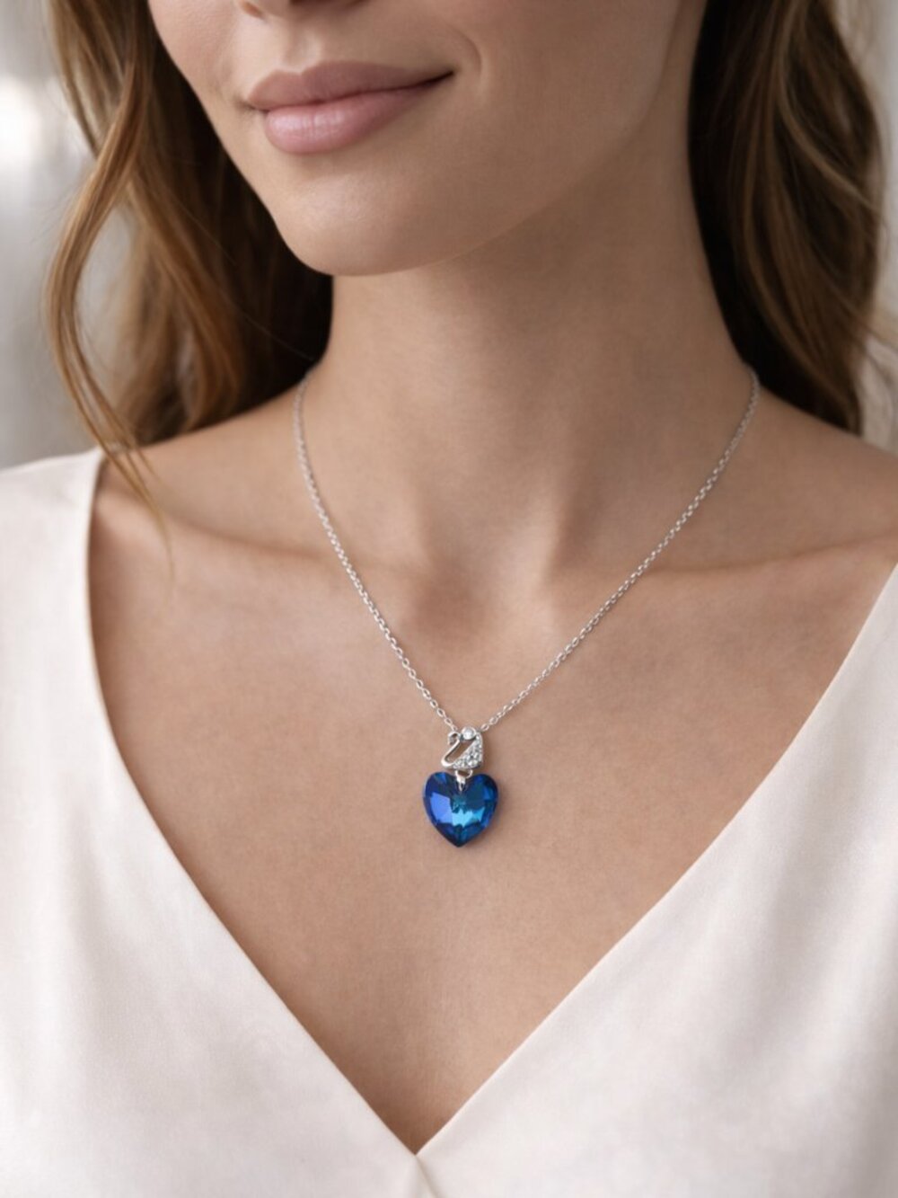 Silver Blue Crystal Heart Necklace with Swan Detail – Elegant Sparkle Pendant